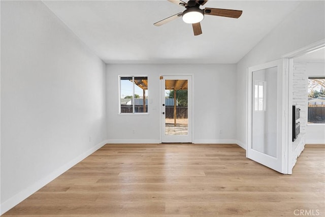 spare room featuring light wood-type flooring and ceiling fan