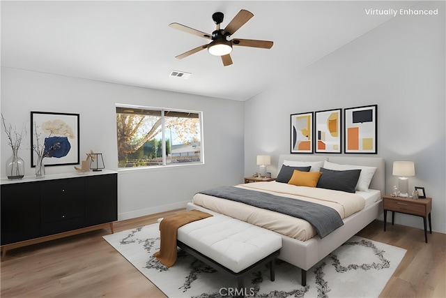 bedroom featuring lofted ceiling, wood-type flooring, and ceiling fan