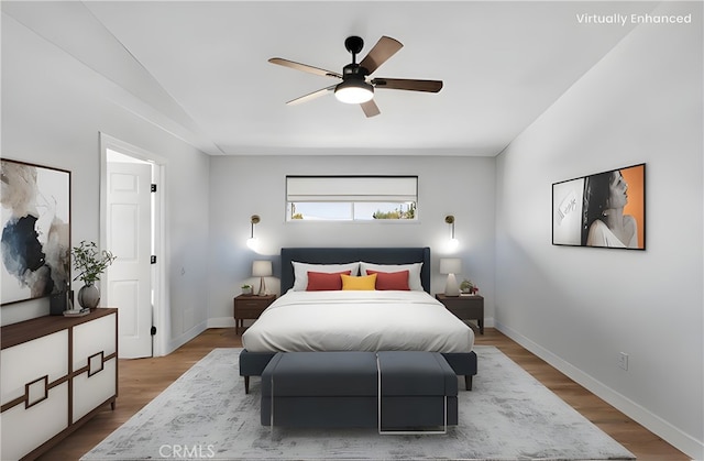 bedroom featuring ceiling fan and hardwood / wood-style flooring