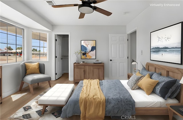 bedroom featuring ceiling fan and light hardwood / wood-style floors