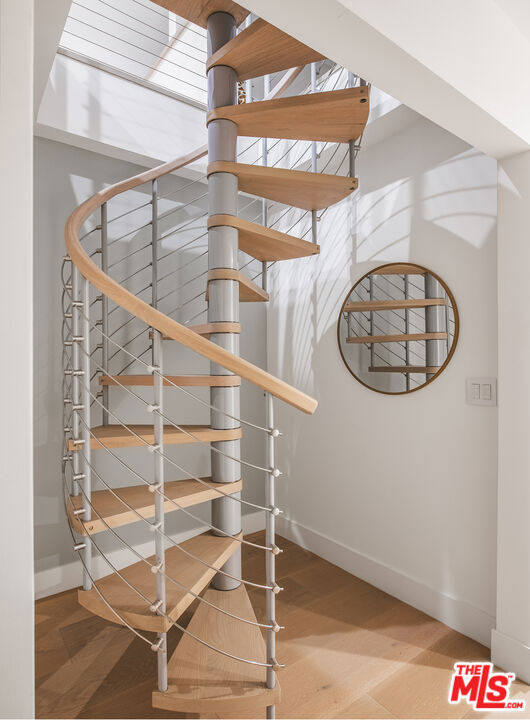 stairs with wood-type flooring