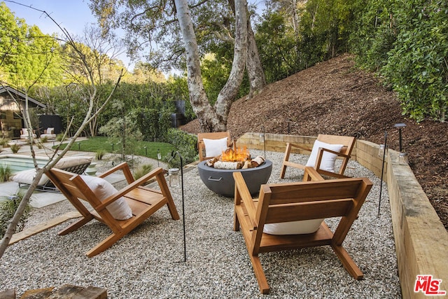 view of patio / terrace with a fire pit