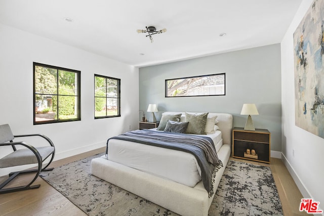 bedroom with light hardwood / wood-style floors