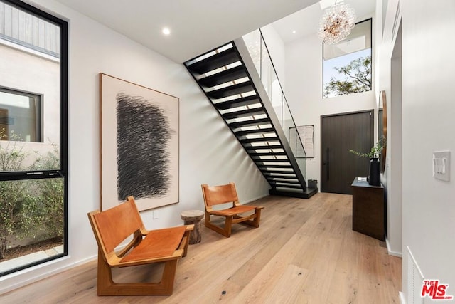 entrance foyer featuring a chandelier and light hardwood / wood-style floors