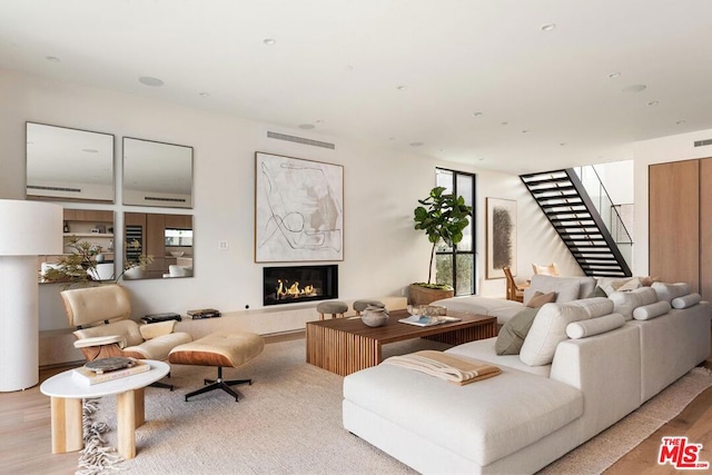 living room with light hardwood / wood-style flooring