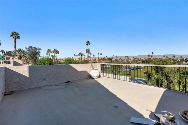 view of patio / terrace featuring a balcony and a mountain view