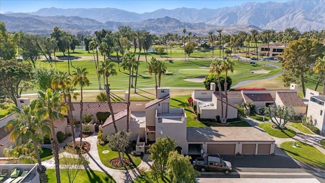 birds eye view of property with a mountain view