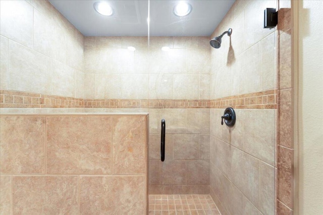 room details featuring a shower with door