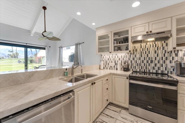 kitchen with lofted ceiling with beams, hanging light fixtures, tasteful backsplash, appliances with stainless steel finishes, and sink