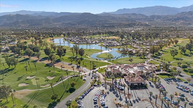 drone / aerial view with a water and mountain view