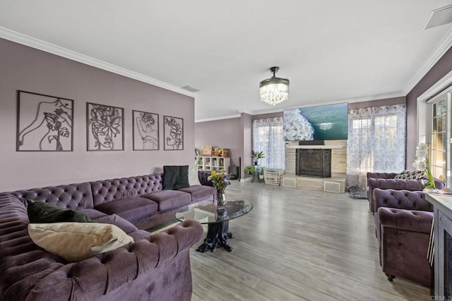 1404 E Mission Rd, Fallbrook, CA 92028 - living area featuring a fireplace, wood finished floors, healthy amount of natural light, crown molding, and a chandelier