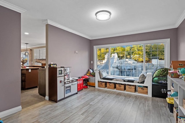 1404 E Mission Rd, Fallbrook, CA 92028 - game room with light wood finished floors, ornamental molding, and baseboards