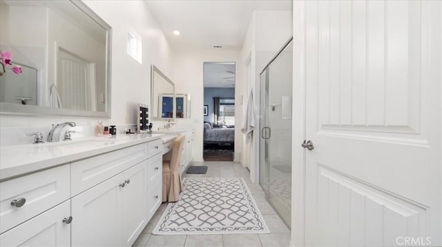 bathroom with vanity, tile patterned floors, and an enclosed shower