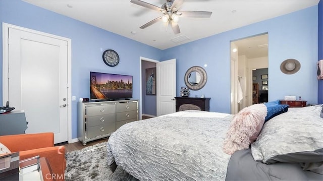 bedroom featuring wood-type flooring and ceiling fan