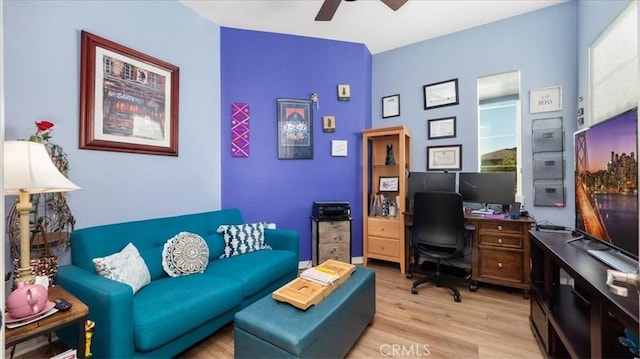 office space with light wood-type flooring and ceiling fan