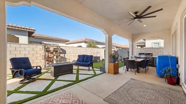 view of patio with an outdoor living space, ceiling fan, and area for grilling