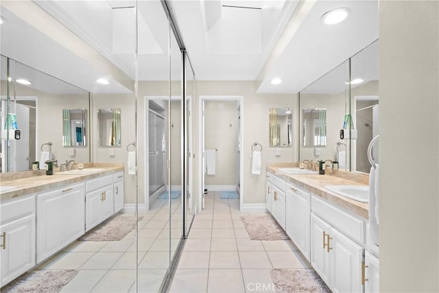 bathroom with tile patterned flooring and vanity