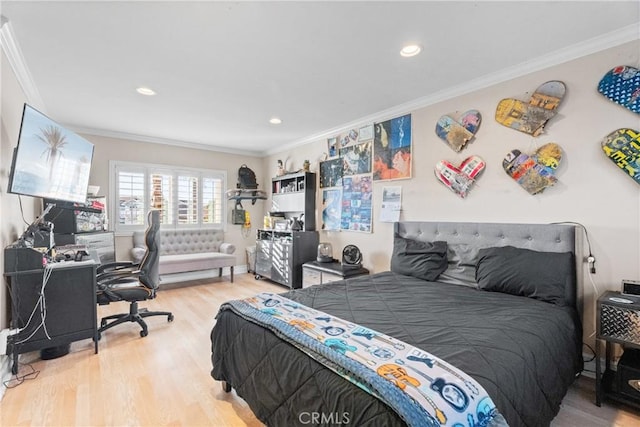 bedroom featuring hardwood / wood-style floors and ornamental molding