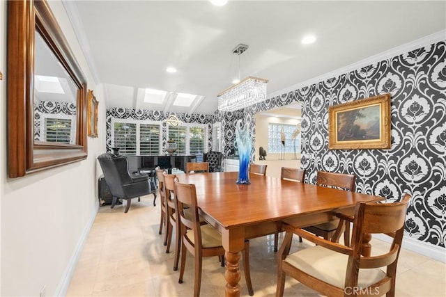 dining area featuring crown molding, vaulted ceiling, and a chandelier