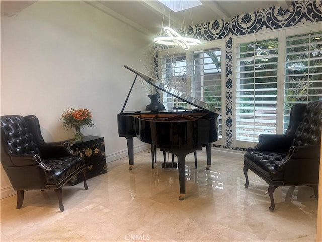 sitting room with a wealth of natural light and a chandelier