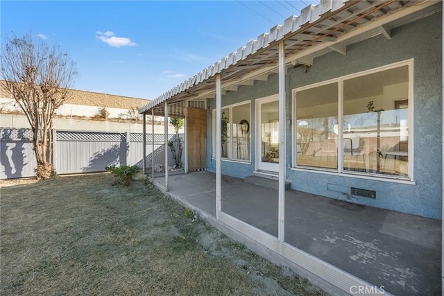 view of home's exterior with a yard and a patio