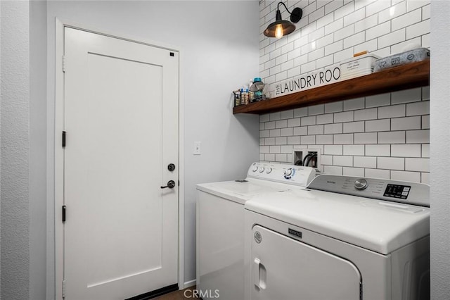 laundry room featuring washing machine and clothes dryer