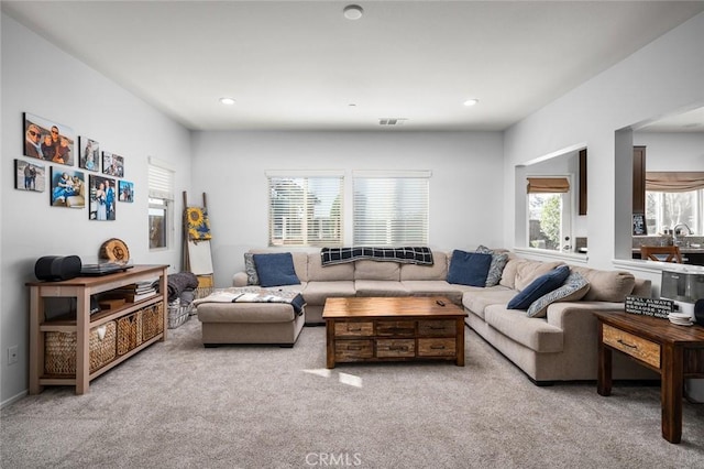 living room with light colored carpet