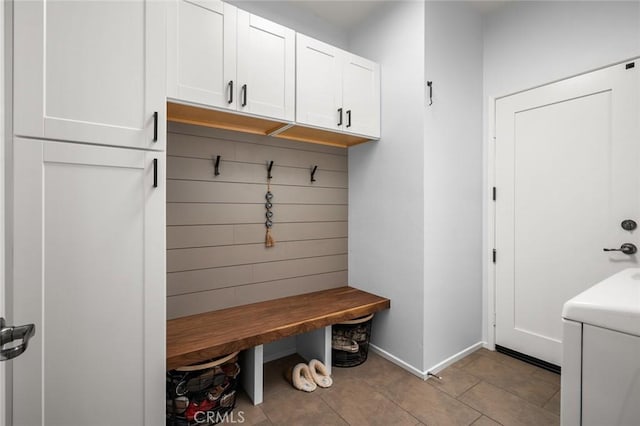 mudroom featuring light tile patterned flooring and washer / clothes dryer