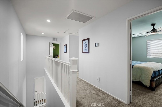 hallway with carpet floors