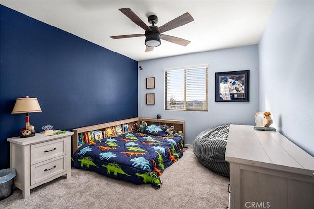 bedroom with ceiling fan and light carpet