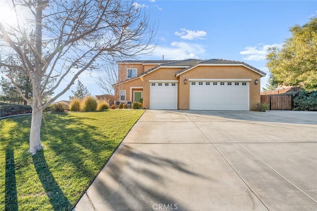 view of front of house with a front yard and a garage