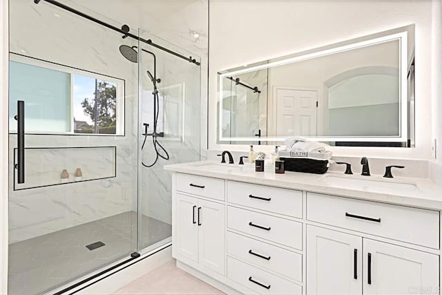 bathroom with vanity and an enclosed shower