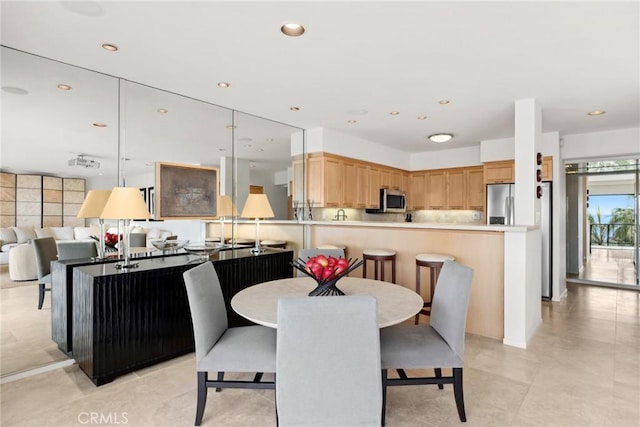 dining space featuring recessed lighting