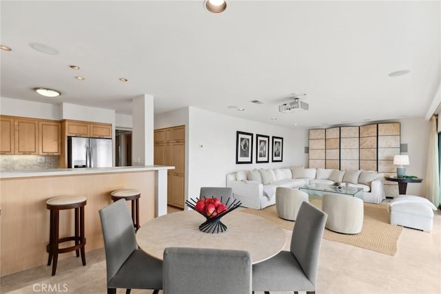 dining room featuring light tile patterned flooring and recessed lighting