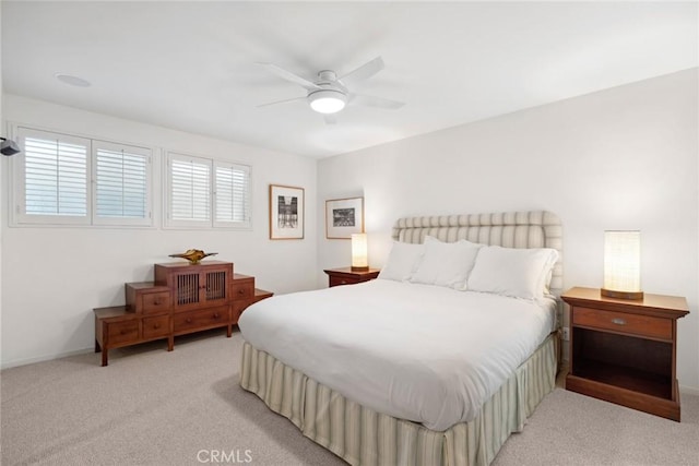 bedroom with light carpet and ceiling fan