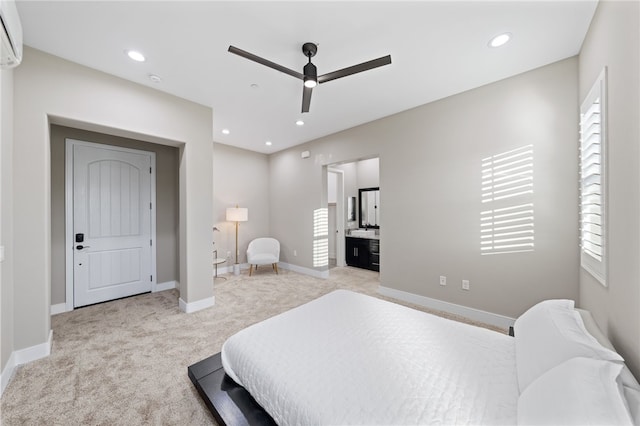 carpeted bedroom with a wall mounted AC, ceiling fan, and ensuite bathroom