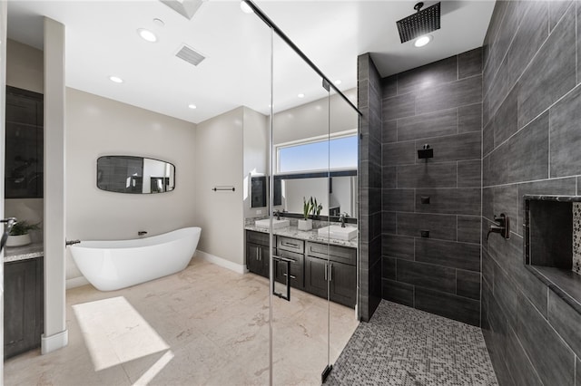 bathroom featuring vanity and separate shower and tub