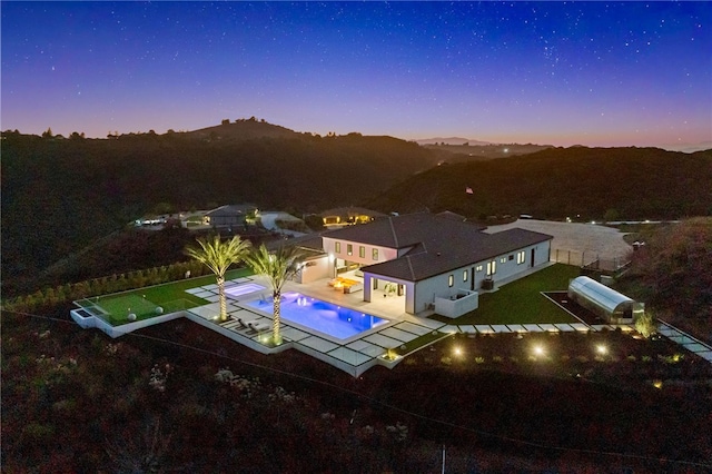 aerial view at dusk with a mountain view