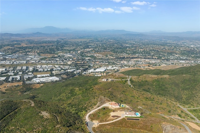 birds eye view of property with a mountain view