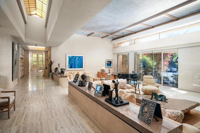 living room featuring a high ceiling