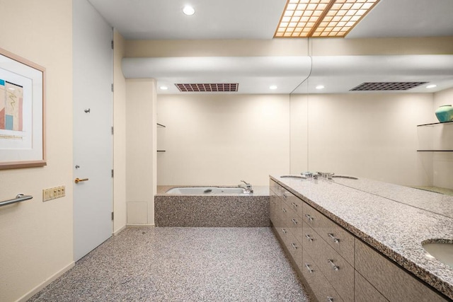 bathroom featuring vanity and a bathtub