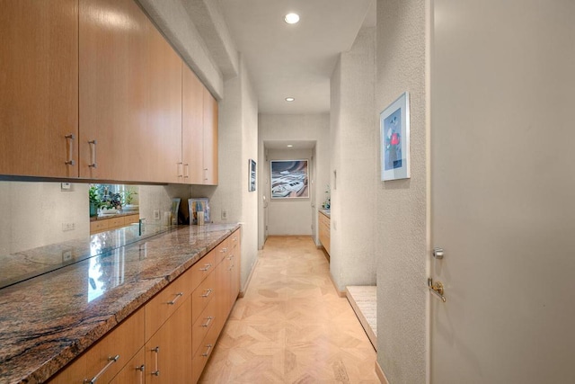 corridor with light parquet floors