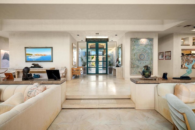 living room with light hardwood / wood-style flooring and french doors