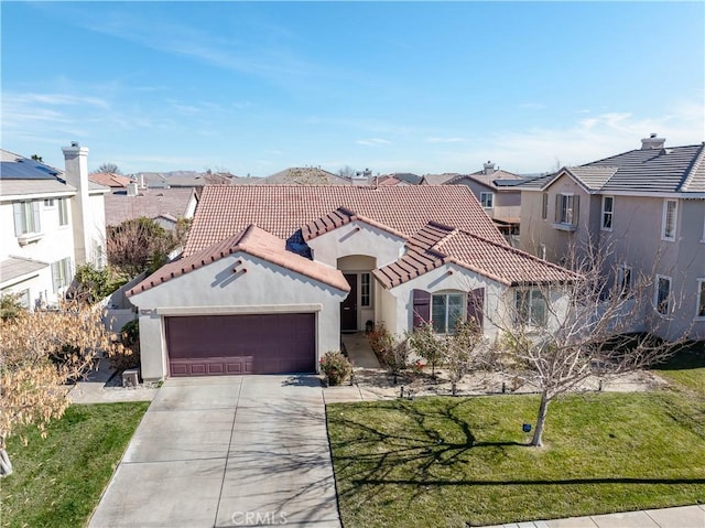 view of front of house with a garage and a front lawn