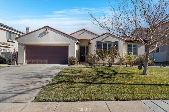 mediterranean / spanish house with a garage and a front lawn