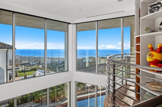 sunroom with a water view