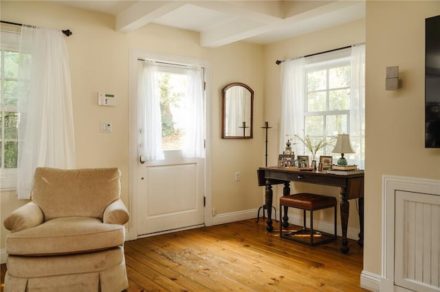 entryway featuring beam ceiling and light wood-type flooring