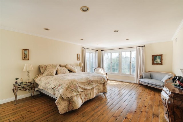 bedroom featuring wood-type flooring and ornamental molding