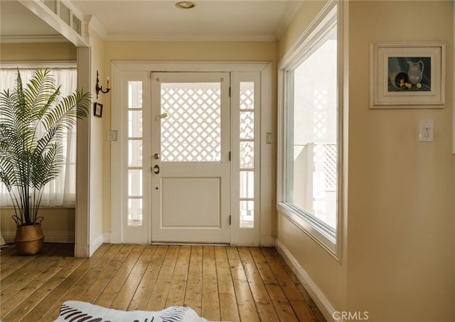 doorway featuring hardwood / wood-style flooring and crown molding