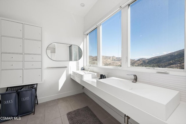 bathroom with a mountain view and tile patterned flooring